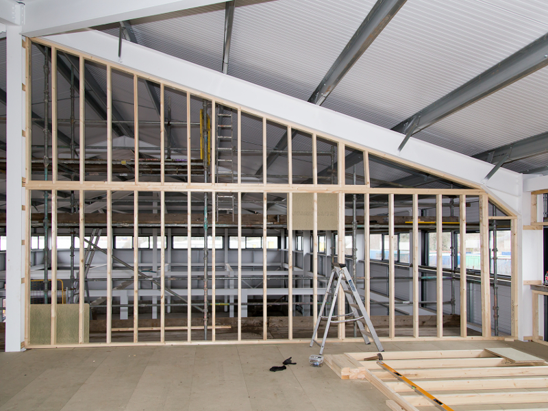 upper office area construction of partition wall and insulation being constructed